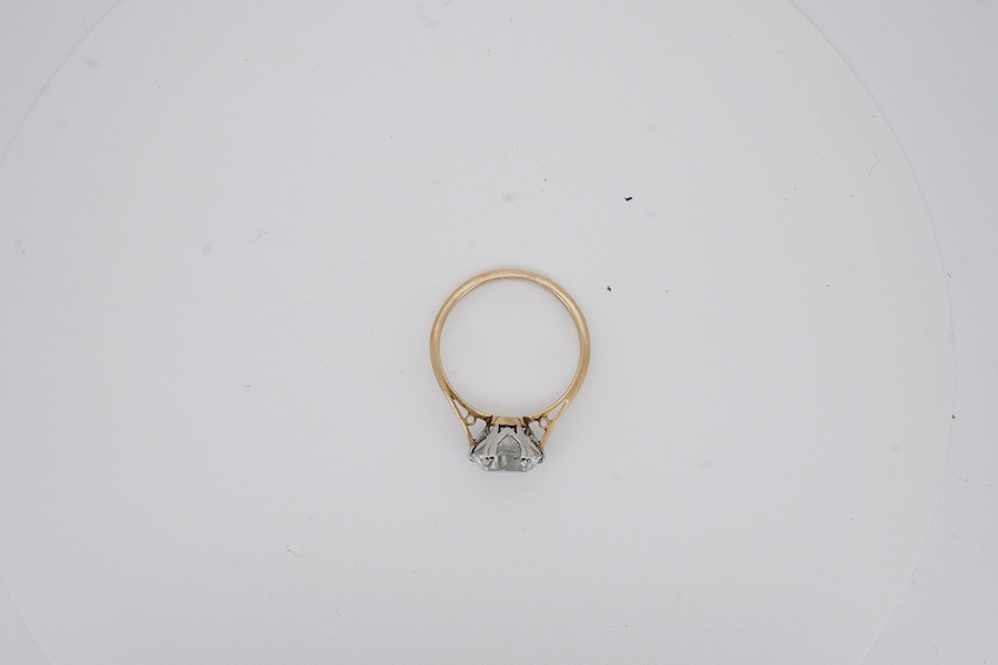 A yellow metal (stamped '9ct sil') and single stone white zircon set ring, gross weight 2.9 grams. Condition - poor to fair